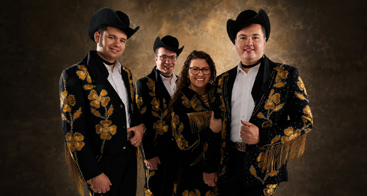 The Kody Norris Show wearing coordinated black-and-gold stage outfits.