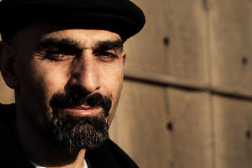 Joseph “DJ Jab” Abajian wearing a black cap and looking toward the camera.