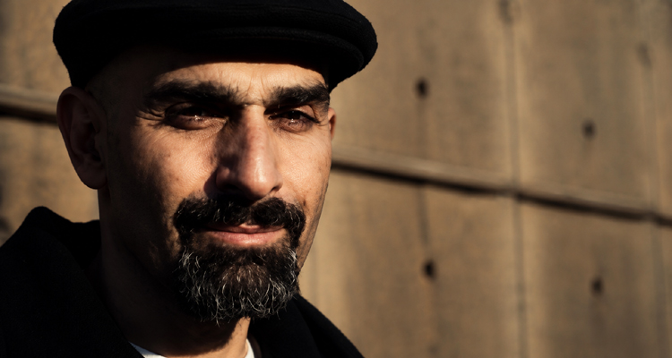 Joseph “DJ Jab” Abajian wearing a black cap and looking toward the camera.